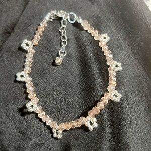 "Embrace a touch of elegance with this delicate light pink glass anklet.